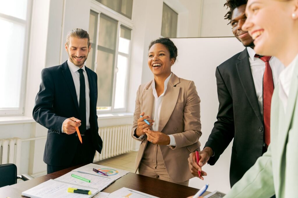Diverse group of new workers smiling in a bright office